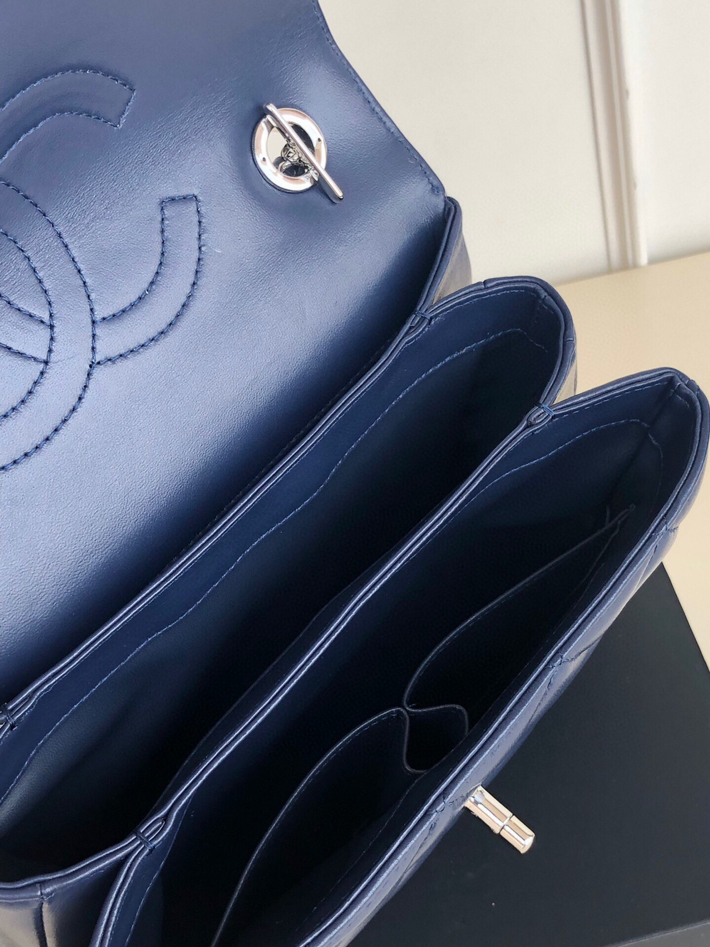 Ch*el flap bag with top handle 6.6 × 9.8 × 4.7 in