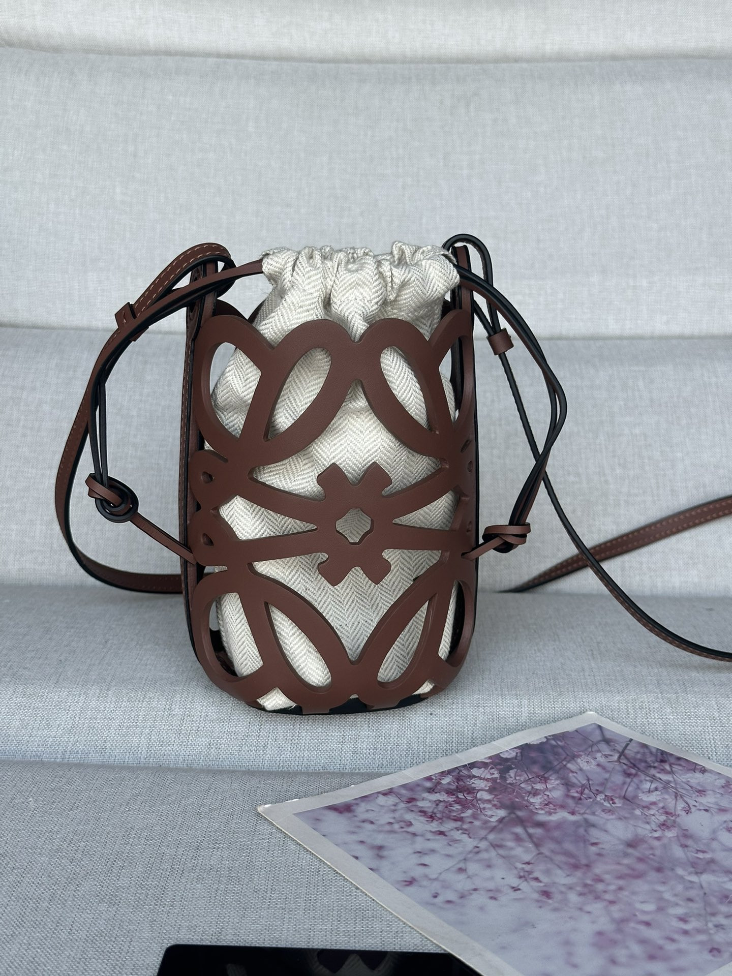 L0ew* anagram cut-out pocket in classic calfskin and canvas 20x11x8cm