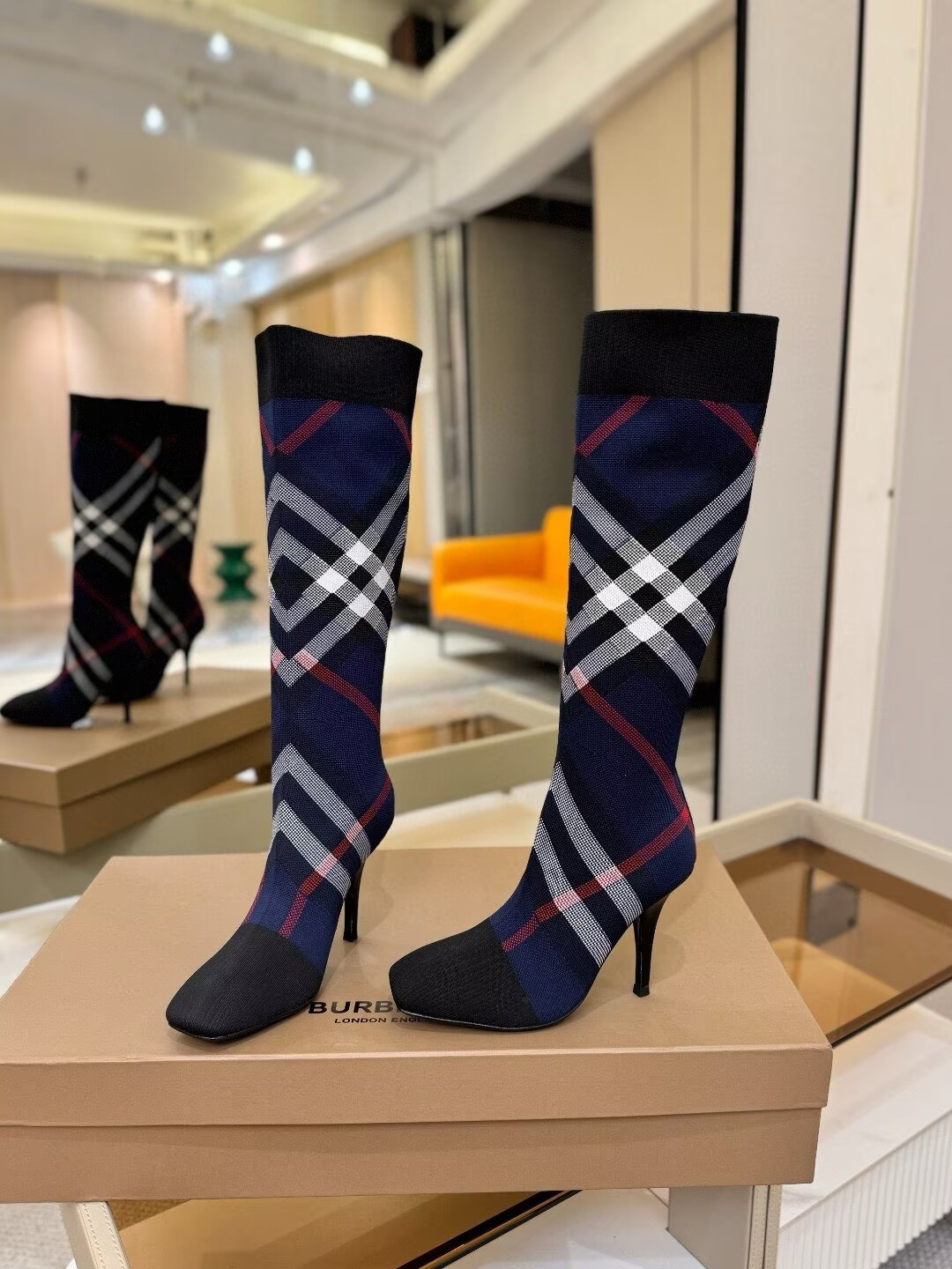 ua Bv*b*rry check high boots