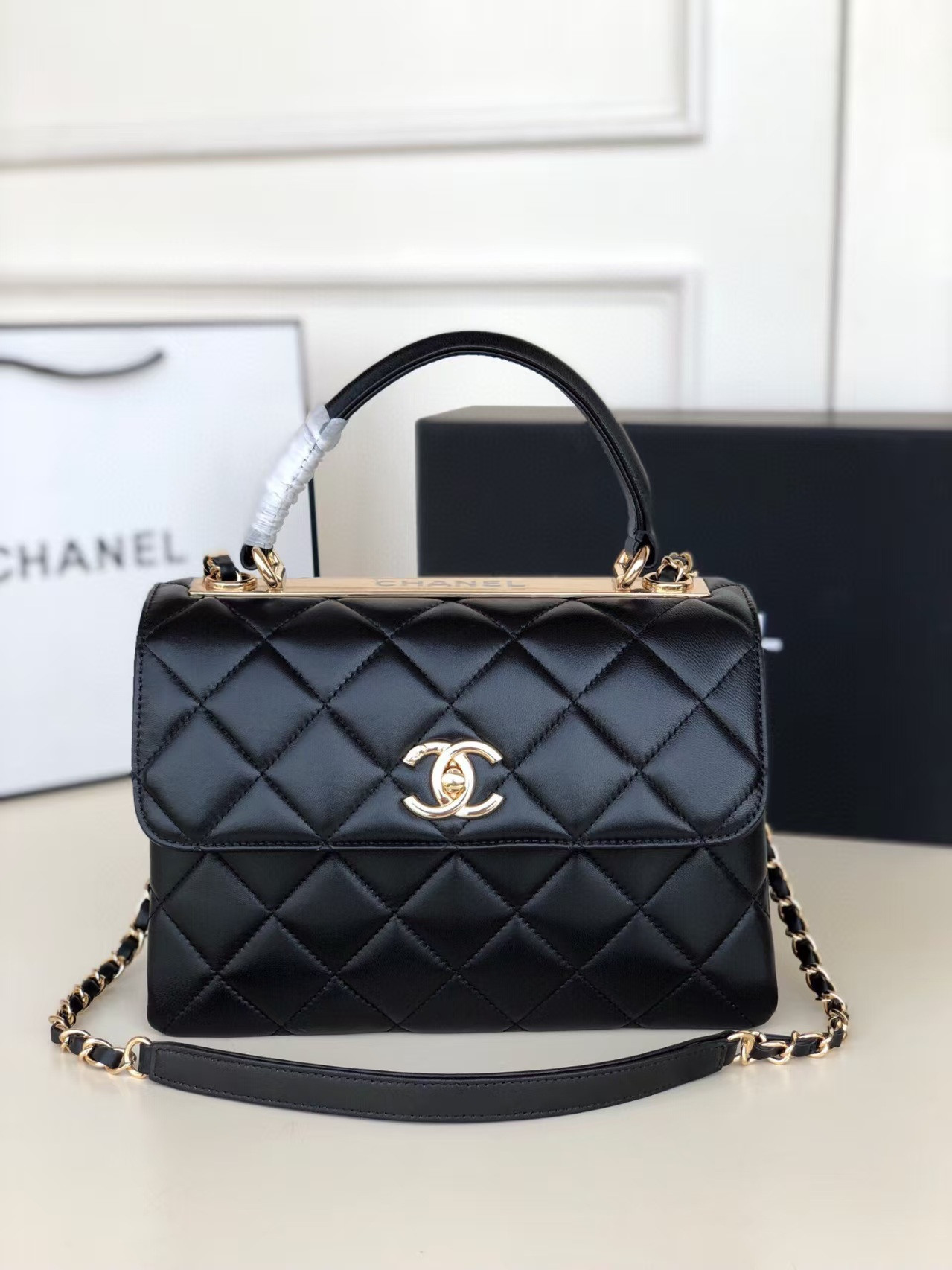 Ch**el flap bag with top handle 6.6 × 9.8 × 4.7 in