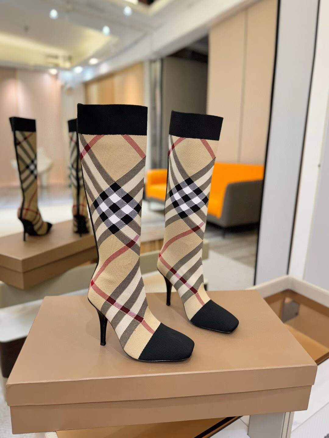 ua Bv*b*rry check high boots