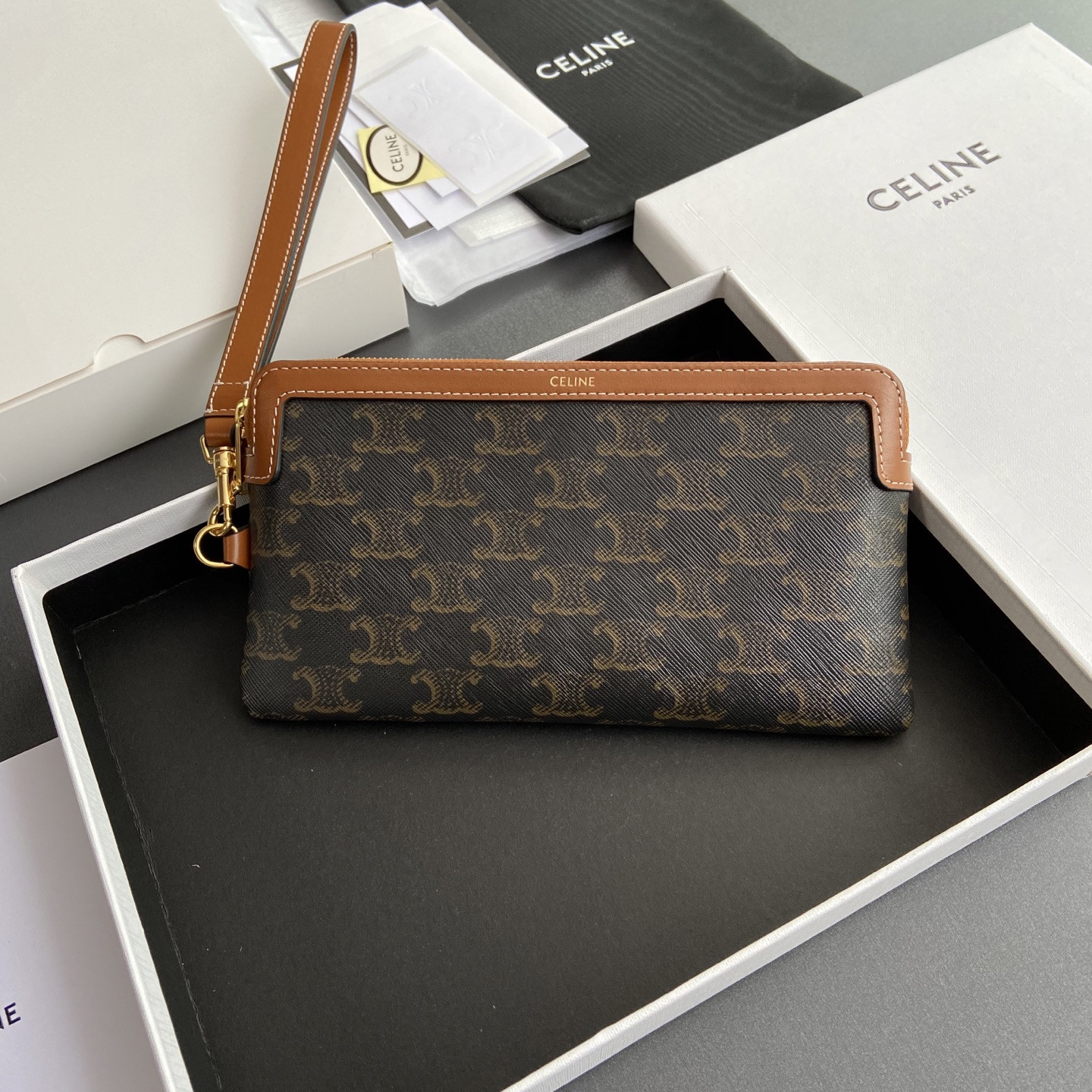 Ce1i*e LONG POUCH WITH STRAP in triomphe canvas and calfskin 21.5x11.5x1cm